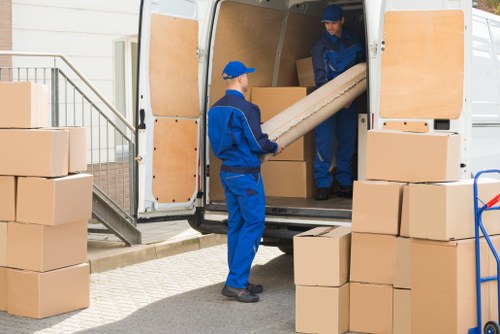 Worker and moving van symbolising ethical labour practices