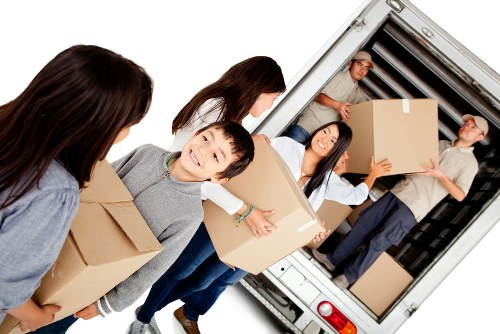Moving van with recyclable boxes and sorted household items in Kingston upon Thames