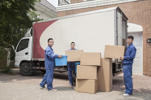 Removal team working in Kingston upon Thames with moving boxes