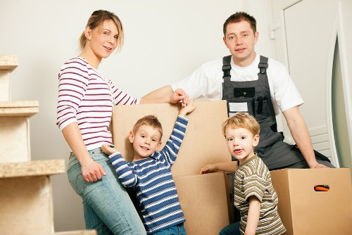 Insured removals crew handling furniture with care