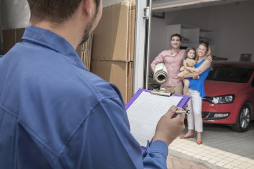 Local moving team organising fragile items for unpacking in Kingston Upon Thames