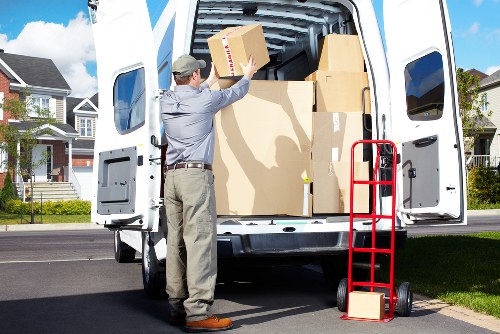 Professional moving van service loading furniture safely