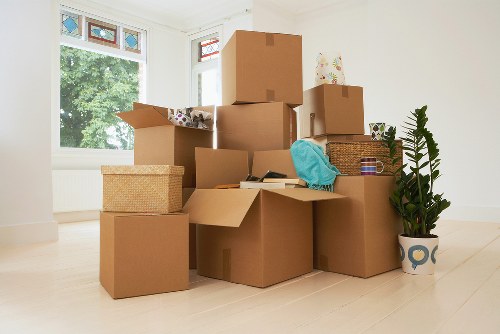 Unpacking services in Kingston upon Thames helping to arrange boxes in a new property