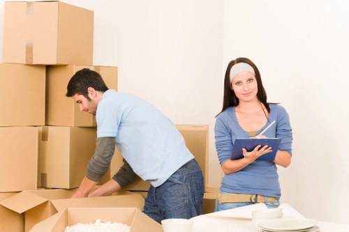 Professional moving truck service loading household items in Kingstonuponthames