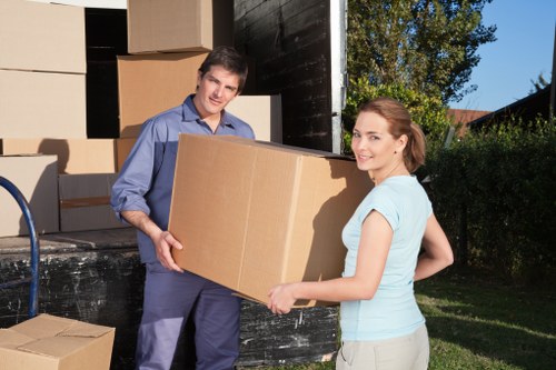 Professional moving team handling boxes in Kingston upon Thames